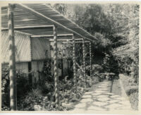 Samuel A. Guiberson residence, view of narrow garden with stone path and pergola, Beverly Hills, 1938