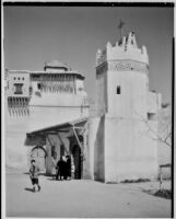 Several people gathered outside a church, Algiers, 1929