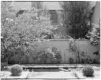 Laura La Plante residence, view of patio, pond and wall, Beverly Hills, 1929