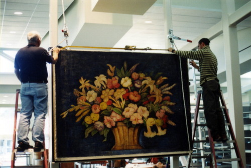 The Canasta de Flores mural by Alfredo Ramos Martinez being set into its steel frame support structure inside the Coronado Public Library, 2004