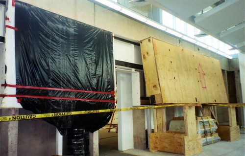 The crated sections of the El Dia del Mercado mural by Alfredo Ramos Martinez were lifted onto supports before being uncrated and placed inside frame, Coronado, 2005