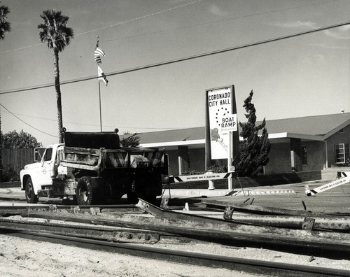 The old railroad tracks are removed from the street in front of City Hall, Coronado. c. 1958
