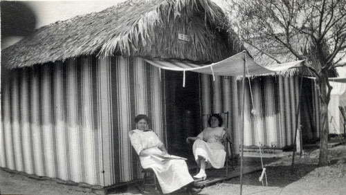 Two women sitting outside tent at Tent City, Coronado, Calif. c. 1910