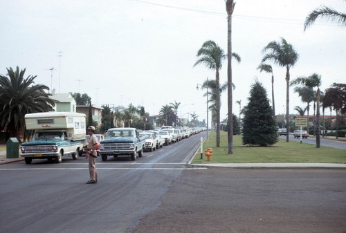 Cars in queue on Orange Avenue waiting to board the ferry bound for San Diego, circa 1968