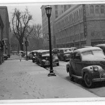 View of the snowstorm that blanketed Sacramento in 1942. This view is looking south down 12th Street near K Street. Weinstock-Lubin Department Store is on the right