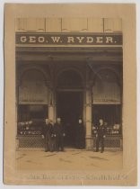 Employees in front of George W. Ryder store exterior