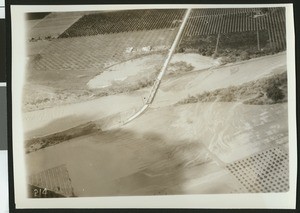 Unidentified view of a bridge and what may be flood damage, ca.1930