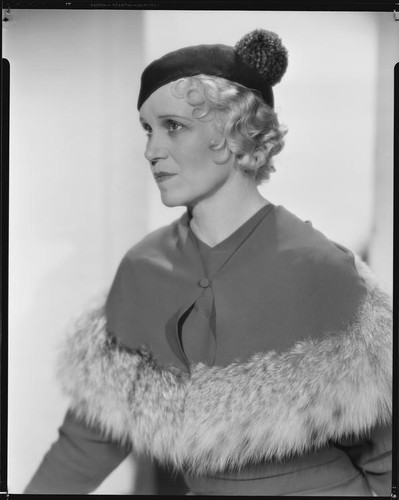 Peggy Hamilton modeling a dress with a matching fur-trimmed capelette, circa 1933
