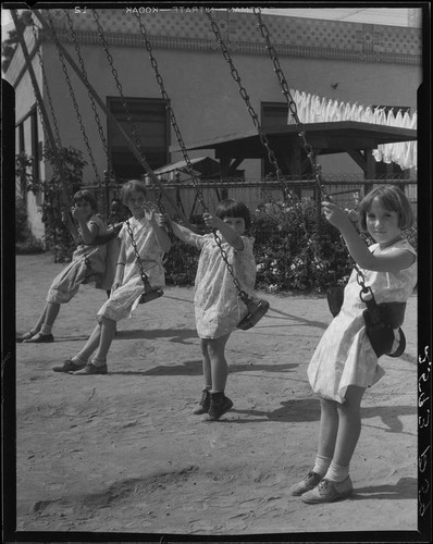 Girls on swings, Los Angeles, circa 1935