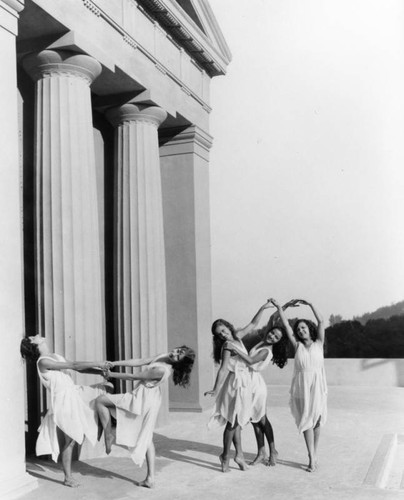 Five dancers in costume at the Greek