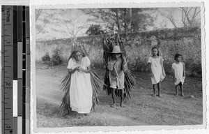 Couple carrying palm fronds, Quintana Roo, Mexico, 1946