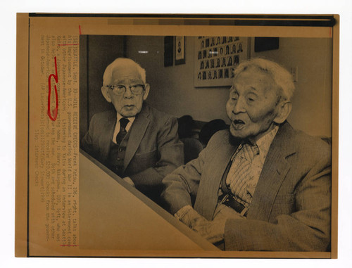 Two Japanese-American men during interviews leading up to receiving redress checks