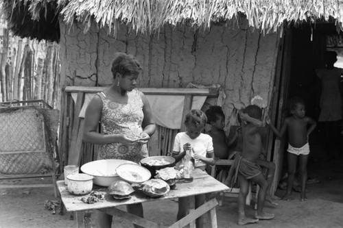 A woman and child prepare food, San Basilio de Palenque, 1977