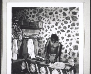 A pupil of Bali College doing his ironing