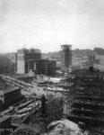 [Cityscape during reconstruction looking northwest from atop South of Market District. Corner of Grant, O'Farrell and Market Sts., center?]