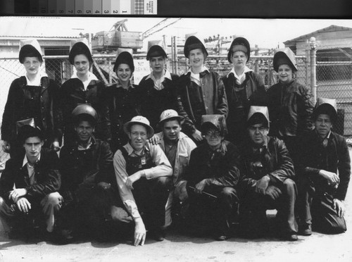[Photograph of shipyard workers]