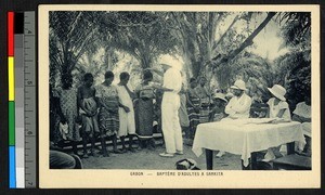 Missionary performing adult baptism, Gabon, ca.1920-1940