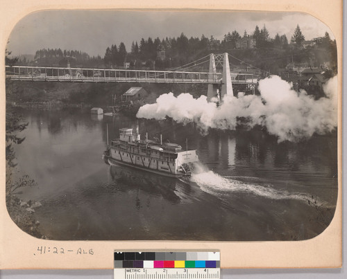 [Pomona (steamboat) on a river, going under a bridge.]