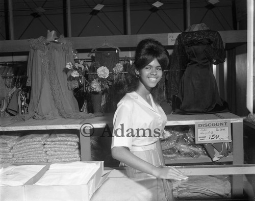 Woman in clothing store, Los Angeles, ca. 1964