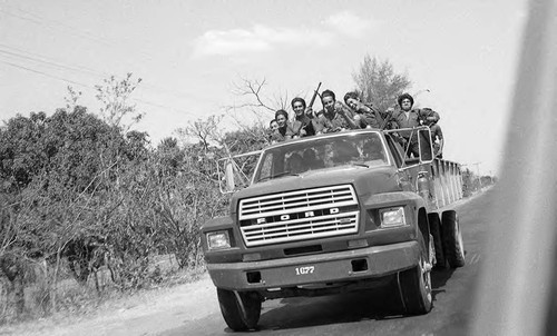 Truck with soldiers on patrol, Ciudad Delgado, San Salvador, 1982