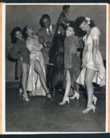 Showgirls with a musician, Los Angeles, 1940s