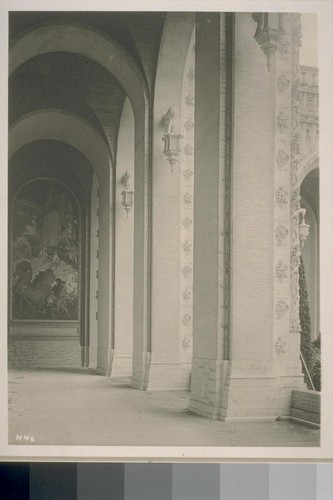H46. [Colonnade, Court of Abundance; with "The Windmill," one panel of the mural "Air" (Frank Brangwyn, painter), at left.]