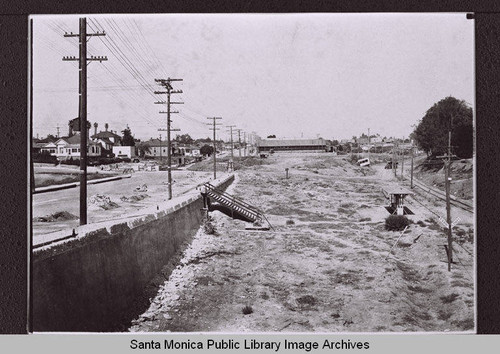The arroyo south of Colorado Avenue looking east to the Patten & Davies Lumber Company at Fourth Street and Colorado Avenue, Santa Monica, Calif