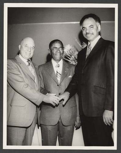 Edgar J. Johnson, George A. Beavers, Jr., and Ivan J. Houston pose for a photograph during Mr. Beavers' birthday celebration