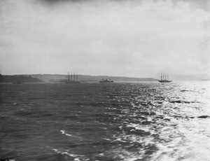 Two frigates and two smaller boats are moving about in the waters of the San Francisco Bay, ca.1900