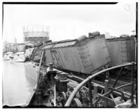 Railroad box car wrecked on barge, Pier 43