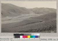 Thousands of gulleys from storm of September 1932 in Tehachapi Mountains when 4.38 inches of rain fell in five hours at Tehachapi. This land had been badly overgrazed and had very little cover. Adjacent lands with forest and brush cover show very little erosion. Slide made. 1932. Metcalf