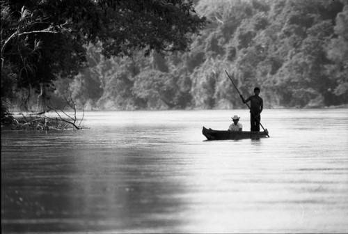 Two refugee men in a canoe, Chiapas, 1983