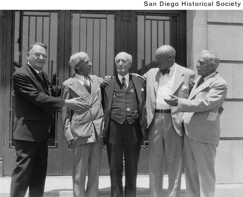 Jack Dodge standing with four unidentified men