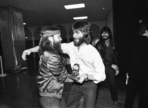 Alabama members celebrating backstage during the 25th Annual Grammy Awards, Los Angeles, 1983