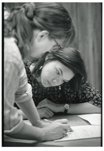 Photograph of two students working on a project