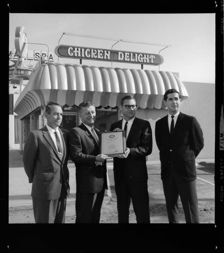 Award presentation to Chicken Delight for total-electric building