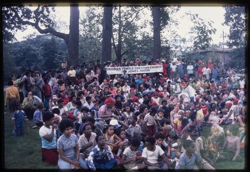 Crowd with Peoples Temple sign