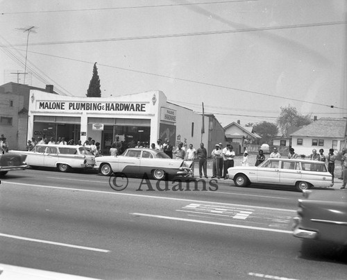 Crowd gathering near Muhammad Mosque #27 for the funeral of Ronald Stokes, Los Angeles, 1962