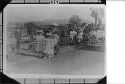 Children with decorated wagons and bicycles in Rose Parade