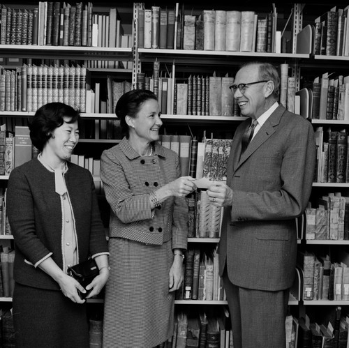 P.P.I. Mrs. Hom and Mrs. Drew present check for $100 to UCSD Library Director Melvyn Voigt, November 16, 1966