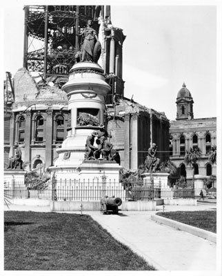[Pioneer Monument, 1906, with City Hall ruins]