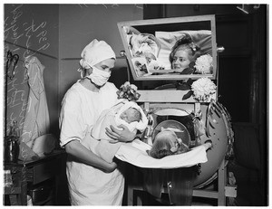 Unusual birth...baby born in Iron Lung ...General Hospital, 1951