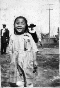 little girl with prize ribbon