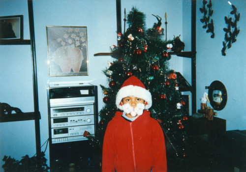 Boy dressed as Santa for Christmas