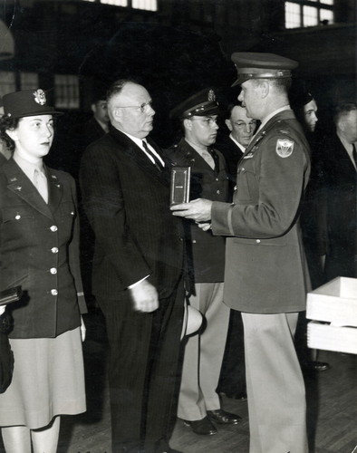 Linwood Blair Receives His Son's Air Medal, 1944