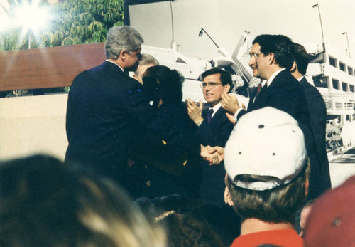 President Clinton shaking hands with officials after he spoke to the community on the one year anniversary of the 1994 Northridge earthquake, 1995