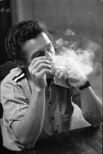 Roberto D'Aubuisson blows smoke, San Salvador, 1983