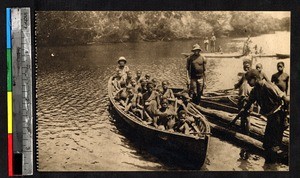 Clergy in a boat with children, Kakyelo, Congo, ca.1920-1940