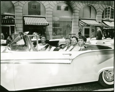 Members of the Order of the Eastern Star riding in convertible automobile