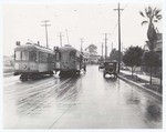 [Two streetcars on a rainy day]